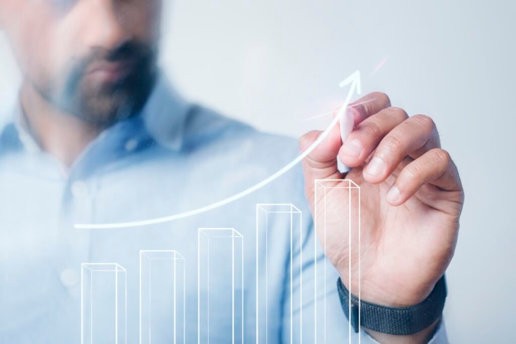 Person calculating return on investment and ROI percentage on a laptop